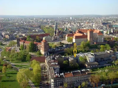 an overhead view of a city with buildings and trees at Apartment Bernardynska in Kraków