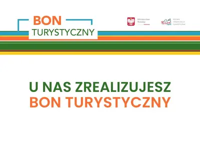 a sign for a website with the words bon tivoliatown and umass at Przy Mocaku in Kraków