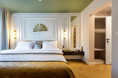 a bedroom with a large bed in a room at Fragola Apartments Old Town in Kraków