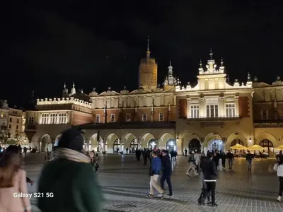 a group of people walking in front of a building at Apartment Łobzowska in Kraków