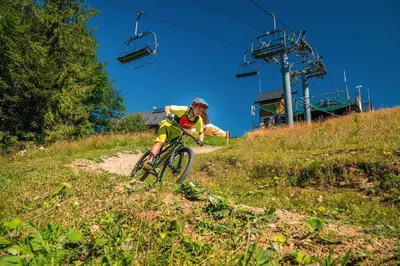 a person riding a bike down a dirt trail at Siedlisko Babia Góra in Zawoja