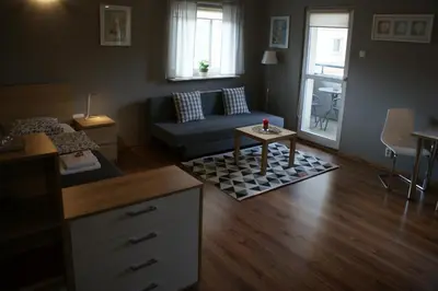 a living room with a couch and a table at Friendly Apartments - Krakow in Kraków
