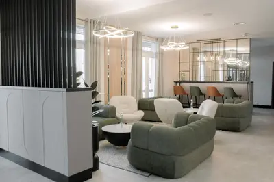 a restaurant with tables and chairs and chandeliers at Hotel Fero Express POKOJE KLIMATYZOWANE AC in Kraków