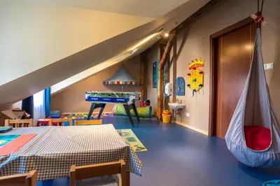 a childs room with a play room with a slide at Niebieski Art Hotel & Spa in Kraków