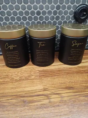 three cups of coffee sitting on top of a wooden table at Apartment in Center in Kraków