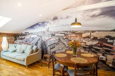 a living room with a wall mural of a city at Designer Apt in the heart of Kraków 4th floor no lift in Kraków