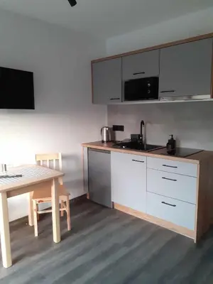 a collage of photos of a kitchen with utensils at Agroturystyka Jagodowa Róża - Maria Farganus in Mszana Dolna