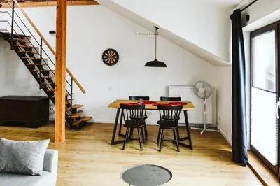 a dining room with a table and chairs at Apartament Myślenice in Myślenice