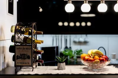 a bowl of fruit on a counter in a kitchen at Verona Apartment 129 - 70m2, Terrace, Garage in Kraków