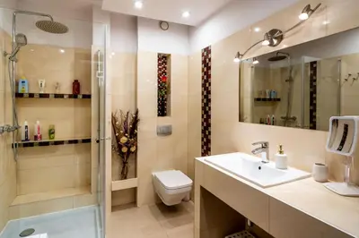 a bathroom with a toilet and a sink and a shower at Verona Apartment 129 - 70m2, Terrace, Garage in Kraków
