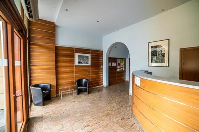 a bar with two chairs and a counter in a room at Verona Apartment 129 - 70m2, Terrace, Garage in Kraków
