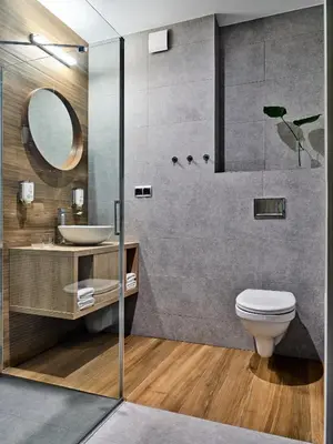 a bathroom with a toilet and a sink and a shower at Hotel Great Polonia Kraków Airport in Modlniczka