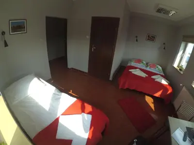 an overhead view of a bedroom with two beds at Hostel Bazar in Kraków