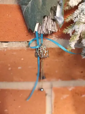 a blue wire is hanging from a wall at Elpida Apartment in Kraków