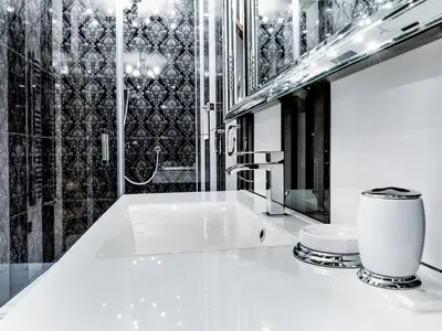 a white bathroom with a sink and a shower at Leonardo 2 in Kraków