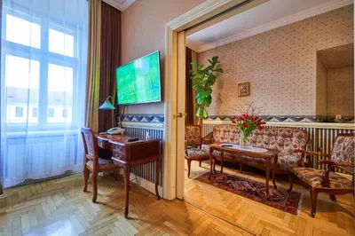a living room with a couch and a table at Pollera in Kraków
