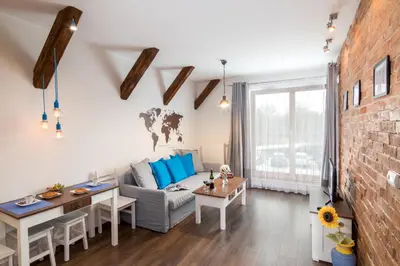 a living room with a couch and a table at Passion4Cracow in Kraków