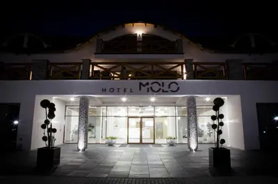 a large pool with blue water in a building at Hotel Molo Resort in Osiek