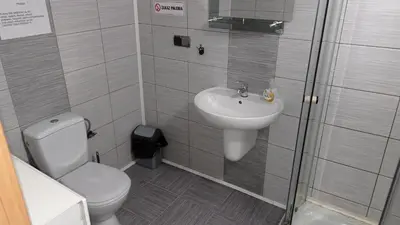 a bathroom with a toilet and a sink at Antares noclegi u Basi in Młoszowa