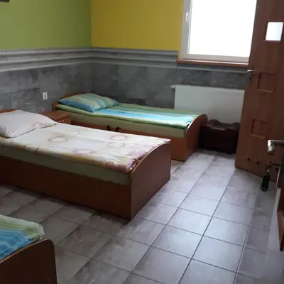 a room with three beds and a window at Antares noclegi u Basi in Młoszowa