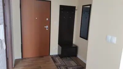 a hallway with two doors and a stair case at Apartament Wilga Park in Kraków