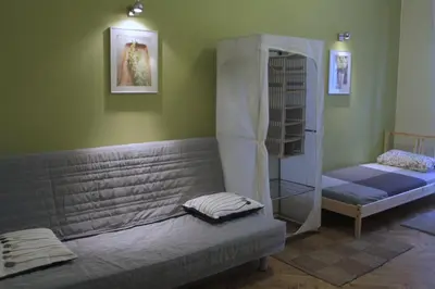 a room with a couch and a bunk bed at 4Party in Kraków