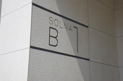 a sign on the side of a building at Kraków Apartments - Solna Studio & Apartments in Kraków