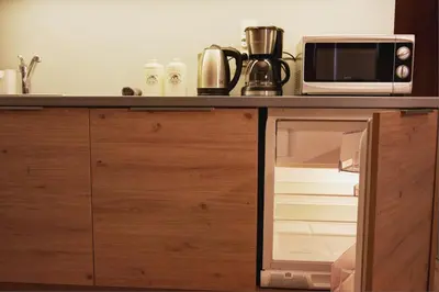 a microwave oven sitting on top of a kitchen counter at Apartment I GrayFor2 Old Town Kraków in Kraków