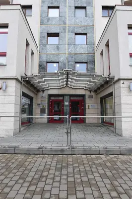 a building with a red door in front of it at Villa Verona in Kraków