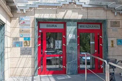 two red doors on the side of a building at Villa Verona in Kraków