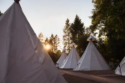 a row of white tents lined up in a row at Wioska Indiańska River Park Zator SPA RESORT in Zator