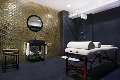 a bathroom with a sink and a mirror at Hotel Kossak in Kraków