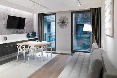 a living room with a couch and a table at Premium Apartments by Wawel Castle in Kraków
