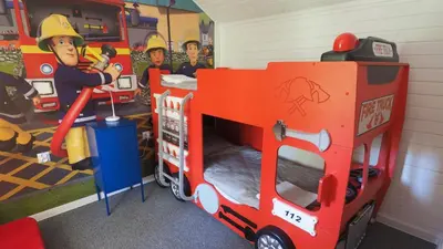 a toy fire truck bed in a room at Chata w Rabce - Bajkowa Osada in Rabka