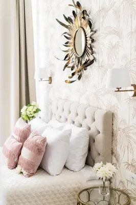 a room with a white couch with pillows and a mirror at Luxe Living Krakow in Kraków