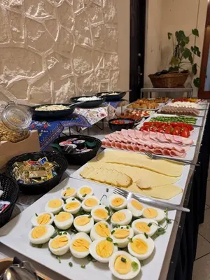 a buffet line with many different plates of food at Hotel Vistula in Kraków