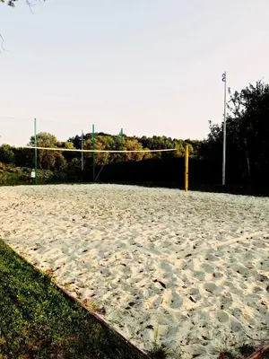 a blue tent in a park next to a light pole at Hotel Vistula in Kraków