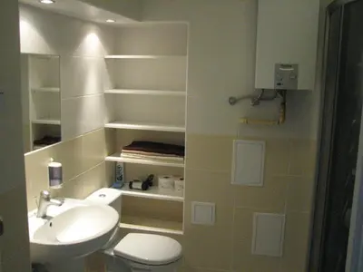 a bathroom with a toilet and a sink at Salwator Apartments in Kraków