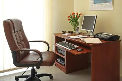 an office with a desk with a computer and a chair at Hotel Great Polonia Conrad Kraków in Kraków