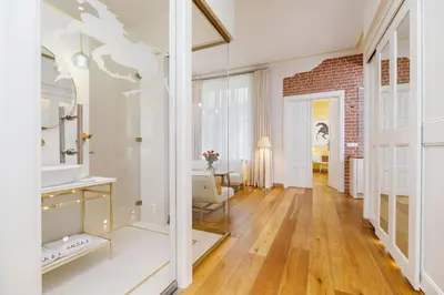 a living room with a brick wall at Apartamenty Bracka 6 in Kraków