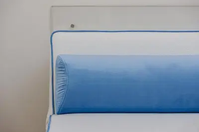 a white refrigerator with a blue box on it at Apartamenty Bracka 6 in Kraków