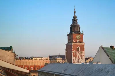 a tall tower with a clock on top of a building at Residence 9 in Kraków