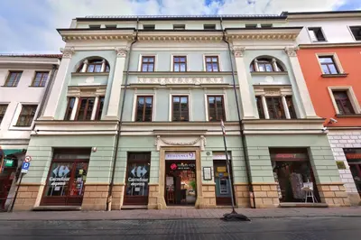 a large building on the corner of a street at Residence 9 in Kraków