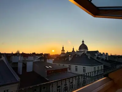 a view of a city skyline at sunset at Residence 9 in Kraków