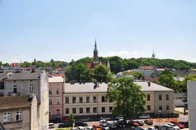 a view of a city with cars parked in a parking lot at apartament studio solna 1 M19 in Kraków