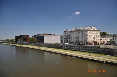 a view of a river with buildings in the background at apartament studio solna 1 M19 in Kraków