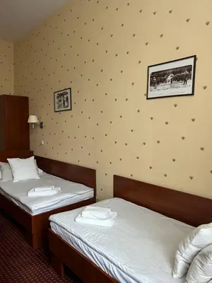 a bathroom with a toilet and a sink at Aneks Hotelu Kazimierz in Kraków