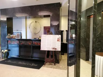 a room with a counter with a large mirror at Hotel Azalia & Spa in Niepołomice
