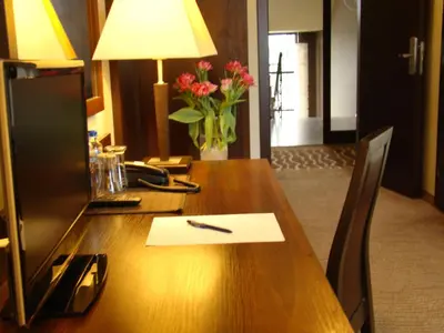 a desk with a pen on top of it at Hotel Azalia & Spa in Niepołomice