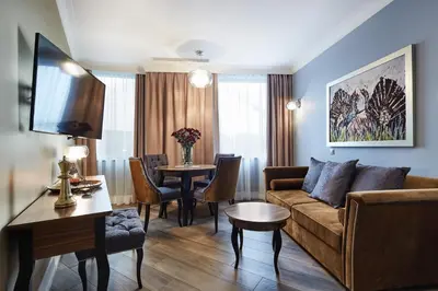 a living room with a couch and a table at Aparthotel Best Views in Kraków